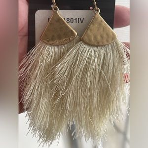 New never worn. Gold with vintage white/cream